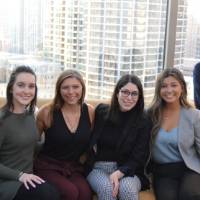 Alumni pose together for a photo